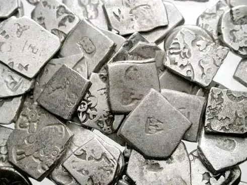 Part of a hoard of square Mauryan silver coins from India, 3rd century BCE